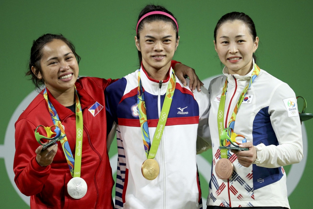 許淑淨（中）成為台灣運動史上第一為奧運雙金選手，獎金可望高達3千萬，將是史上最高獎金。（路透）