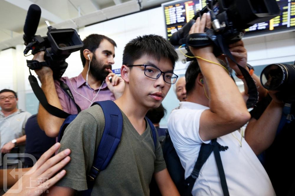 香港學運領袖黃之鋒21日撰文回應宋哲，反駁「香港自決是偽命題」論點。（湯森路透）