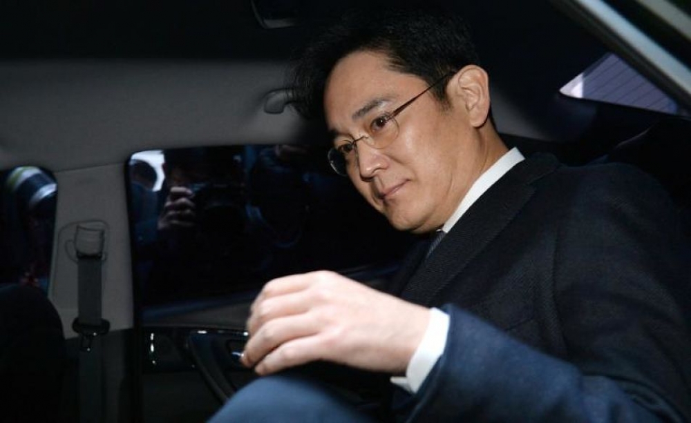 涉政治醜聞，三星少主李在鎔17日清晨遭南韓法院正式逮捕。（湯森路透）