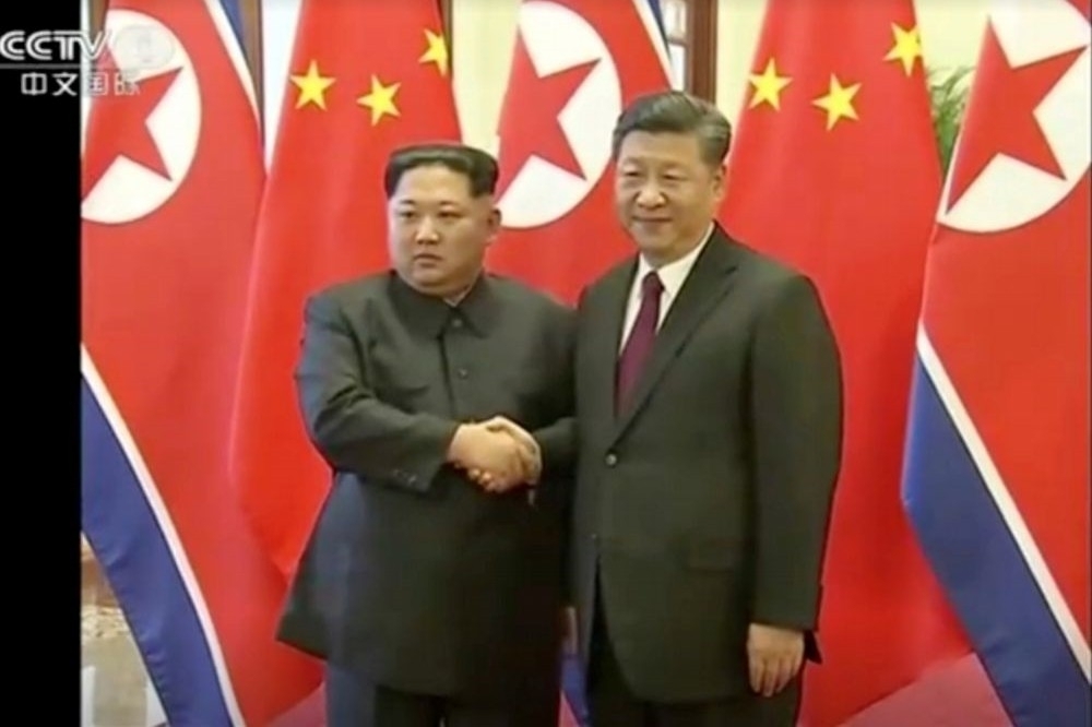 北韓領導人金正恩26日與中國國家主席習近平見面。（湯森路透）