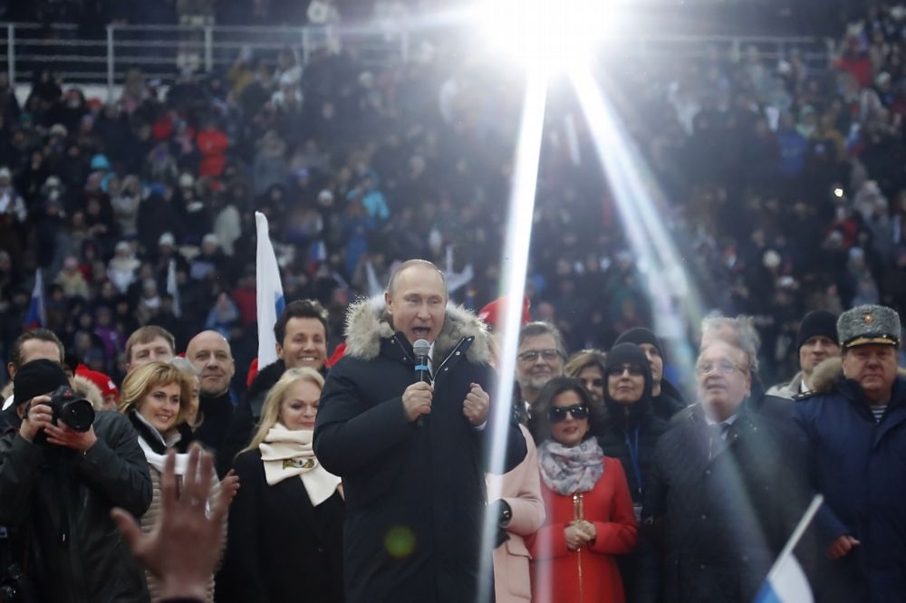 俄羅斯總統普京參加選舉造勢活動。（湯森路透）