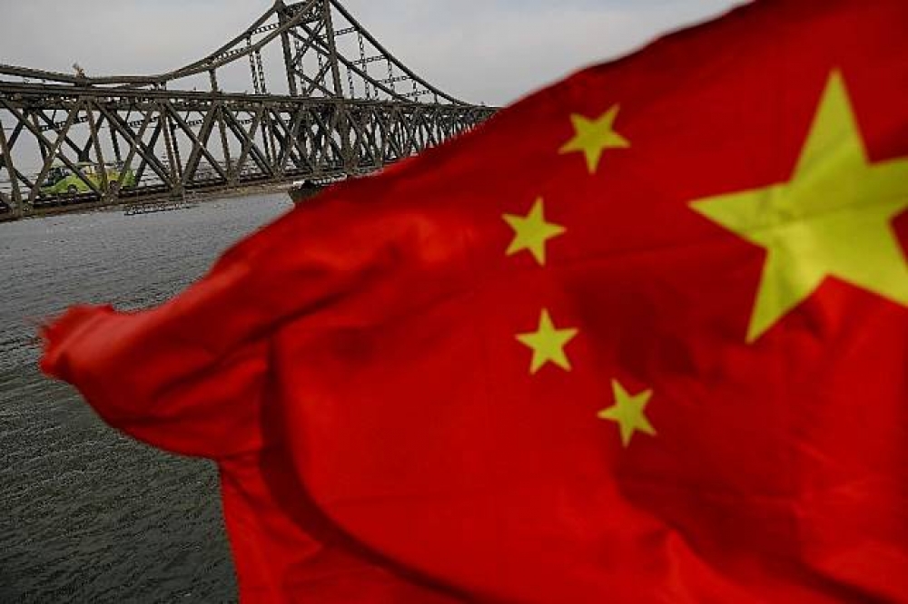 據《路透社》（Reuters）報導，中國遼寧省丹東市仍有民眾出團前往北韓旅遊。圖為位於鴨綠江上的中朝友誼橋。（湯森路透）