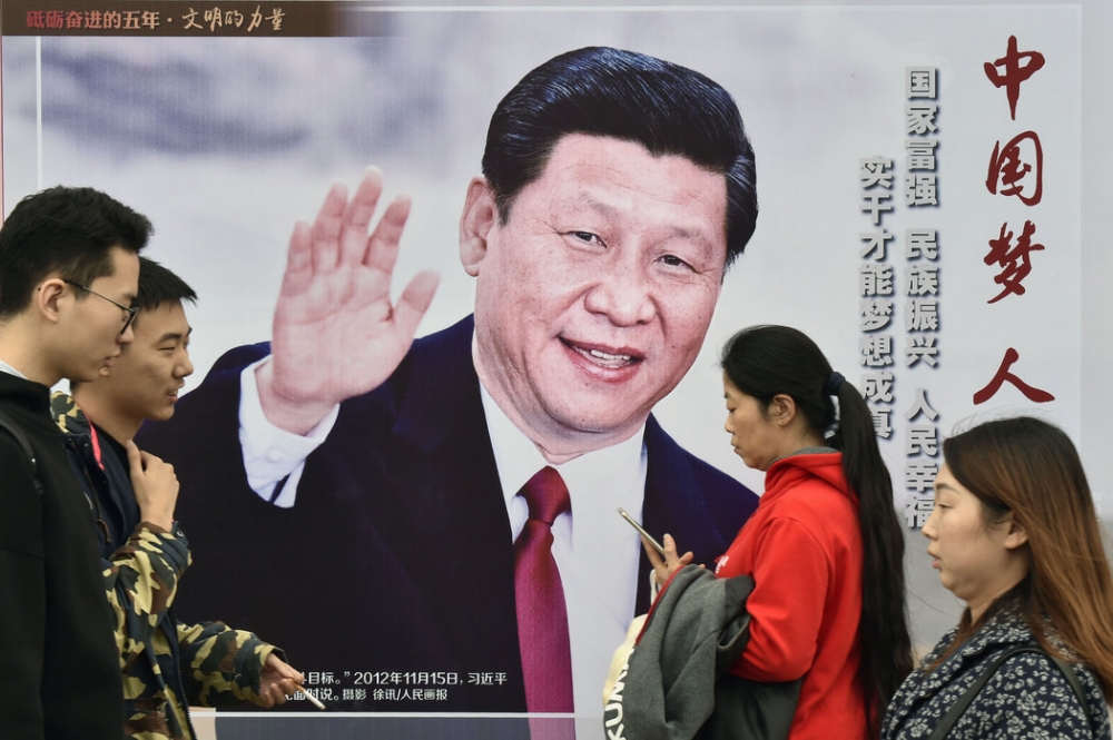 北京的一張畫報宣傳著習近平主席的成就。 （KYODO NEWS, VIA GETTY IMAGES）