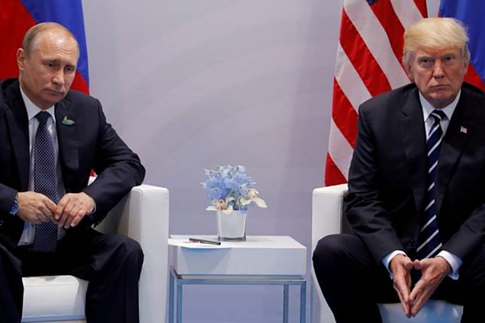 俄羅斯總統普京與美國總統川普7月現身德國漢堡G20峰會。（湯森路透）