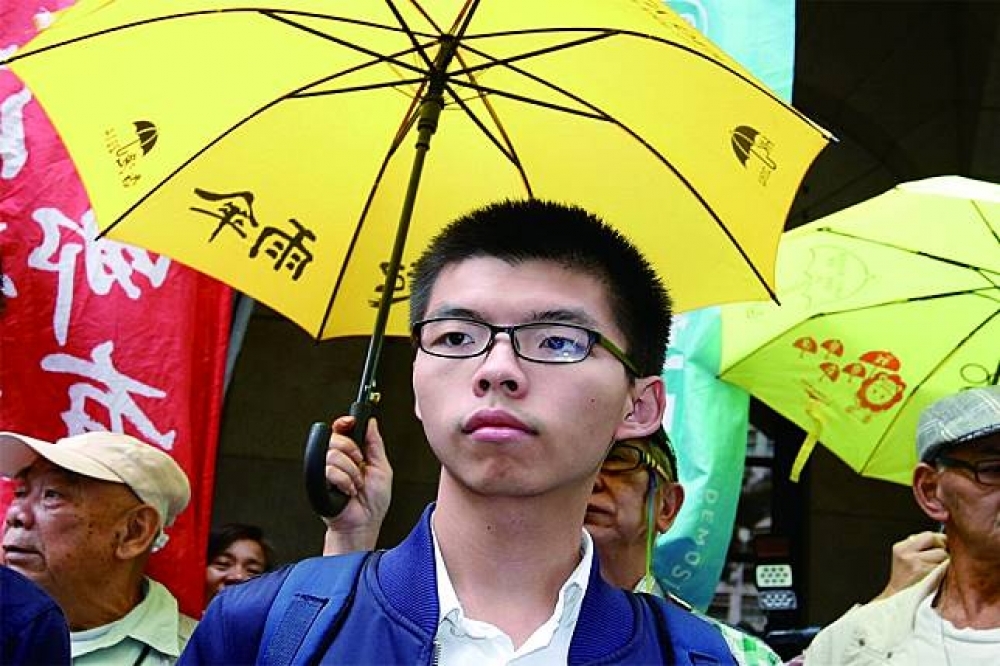 香港「雙學三子」（黃之鋒、羅冠聰、周永康）繼之被加判6~8個月不等的刑期，代表香港政壇的角力，已延伸到司法這最後一塊淨地。圖為黃之鋒。（湯森路透）