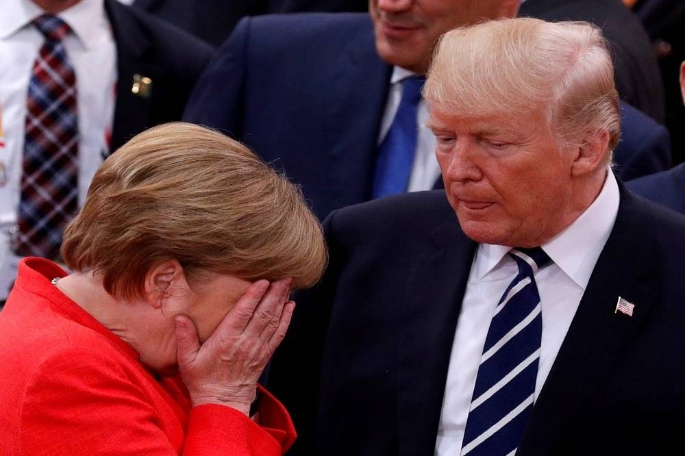 德國總理梅克爾與美國總統川普現身7月於漢堡登場的G20會議。（湯森路透）