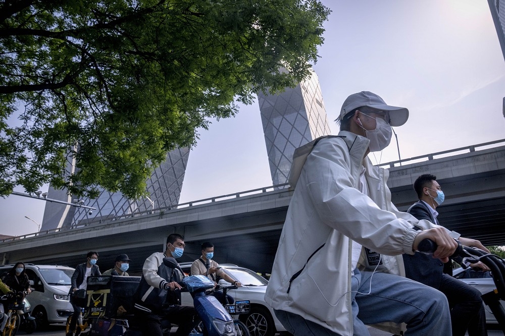 北京街頭湧現自行車潮。（美聯社）