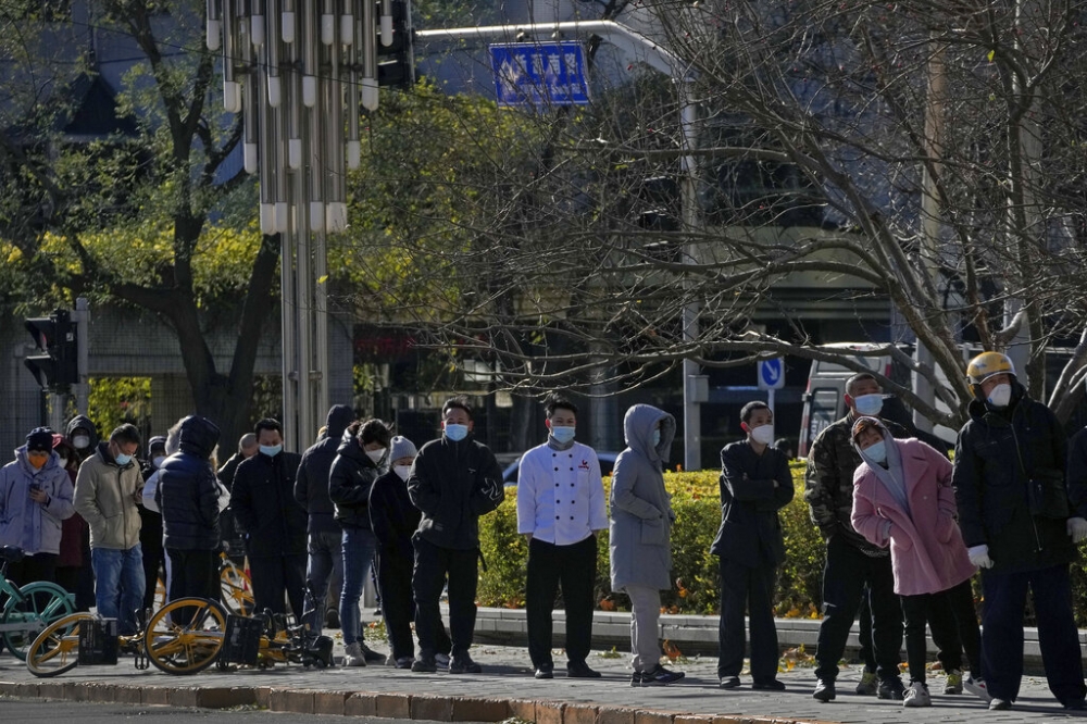 作者说：封控等于「掘墓」，埋葬人民，也终将埋葬中共政权。（美联社）(photo:UpMedia)